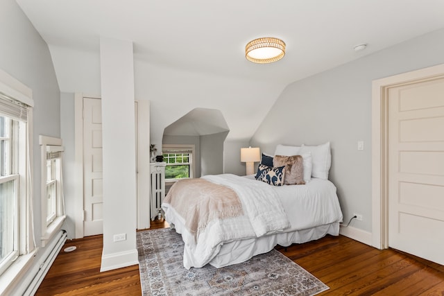 2423 Harrison St, Evanston, IL 60201 - bedroom featuring a baseboard radiator, vaulted ceiling, and wood finished floors