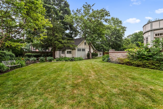 2423 Harrison St, Evanston, IL 60201 - view of yard with an attached garage and an outdoor structure
