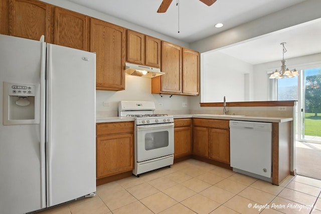 509 Legend Ln, Mchenry, IL 60050 - kitchen with white appliances, under cabinet range hood, light countertops, a ceiling fan, and brown cabinets