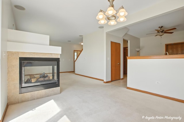 509 Legend Ln, Mchenry, IL 60050 - unfurnished living room featuring carpet, a fireplace, a chandelier, and a ceiling fan