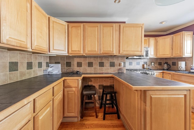 4941 W 119th St, Alsip, IL 60803 - kitchen with light brown cabinetry, stove, light wood-style floors, tile countertops, and ornamental molding