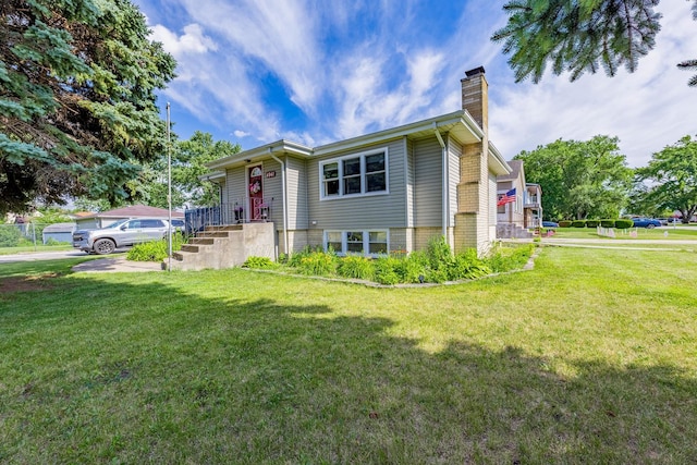 4941 W 119th St, Alsip, IL 60803 - view of front of home featuring a chimney and a front yard
