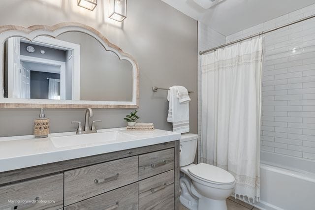 1906 Heatherway Ln Unit 7, New Lenox, IL 60451 - bathroom featuring vanity and shower / bathtub combination with curtain