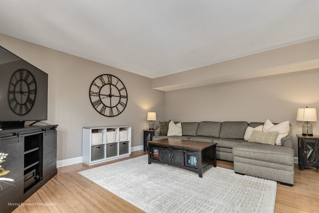 1906 Heatherway Ln Unit 7, New Lenox, IL 60451 - living room with light wood-style flooring and baseboards