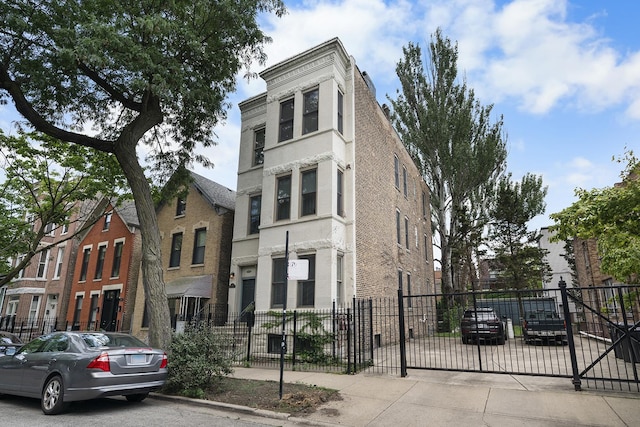 1849 W Superior St Unit 3, Chicago, IL 60622 - view of front facade featuring brick siding and a gate
