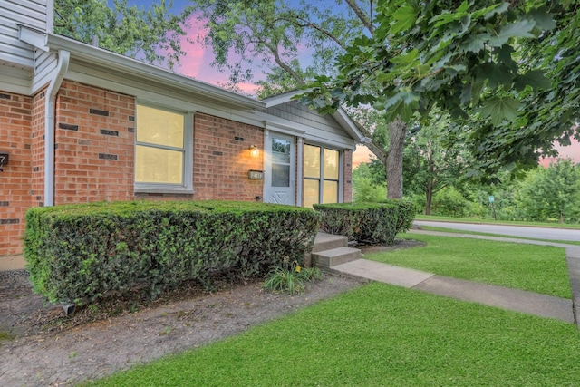 4018 Oxford Ct, Streamwood, IL 60107 - view of front facade with brick siding and a yard