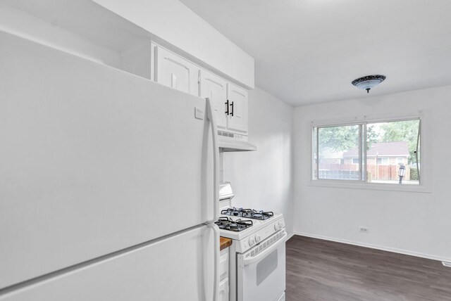 4018 Oxford Ct, Streamwood, IL 60107 - kitchen with white appliances, under cabinet range hood, white cabinets, and wood finished floors