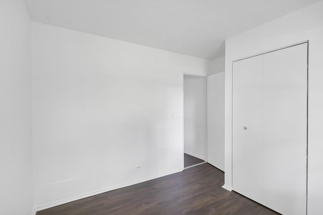 4018 Oxford Ct, Streamwood, IL 60107 - unfurnished bedroom with dark wood-type flooring and a closet