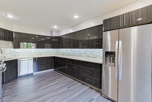 1521 Whitman Ct, Schaumburg, IL 60173 - kitchen with stainless steel appliances, modern cabinets, decorative backsplash, light countertops, and recessed lighting
