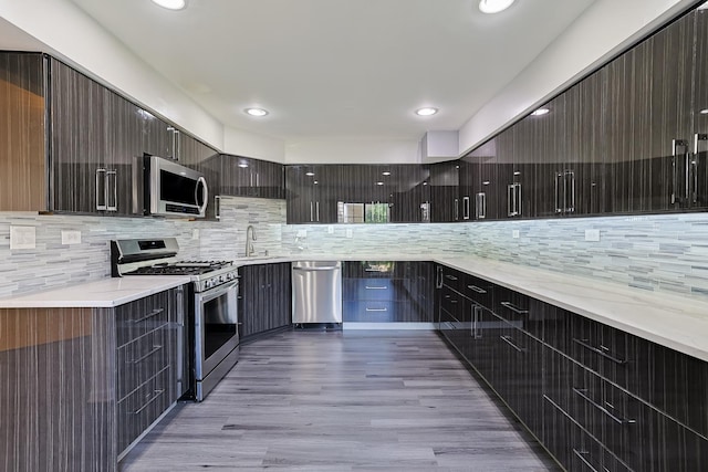 1521 Whitman Ct, Schaumburg, IL 60173 - kitchen featuring stainless steel appliances, modern cabinets, decorative backsplash, and recessed lighting