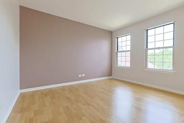 1521 Whitman Ct, Schaumburg, IL 60173 - spare room with light wood-type flooring and baseboards