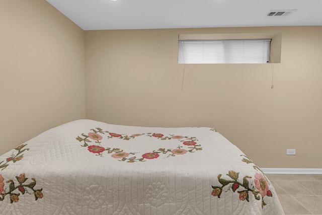 5609 N Mango Ave Unit 1W, Chicago, IL 60646 - bedroom featuring baseboards and tile patterned floors