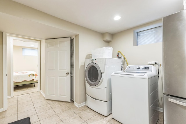 5609 N Mango Ave Unit 1W, Chicago, IL 60646 - washroom with independent washer and dryer, light tile patterned floors, and recessed lighting