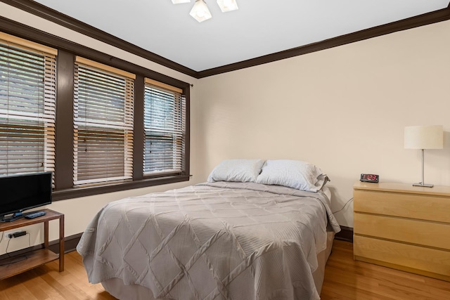 5609 N Mango Ave Unit 1W, Chicago, IL 60646 - bedroom featuring crown molding and wood finished floors