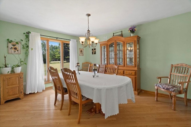 344 Prairie Ave, Winthrop Harbor, IL 60096 - dining room featuring a chandelier and light wood-type flooring