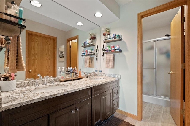 344 Prairie Ave, Winthrop Harbor, IL 60096 - bathroom with double vanity, a shower stall, and recessed lighting