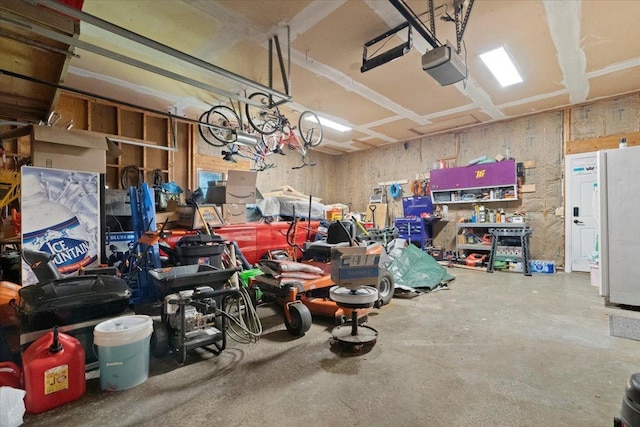 344 Prairie Ave, Winthrop Harbor, IL 60096 - garage featuring a garage door opener and a workshop area