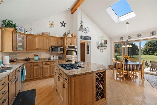 344 Prairie Ave, Winthrop Harbor, IL 60096 - kitchen with stainless steel appliances, light wood-style flooring, high vaulted ceiling, a skylight, and beam ceiling