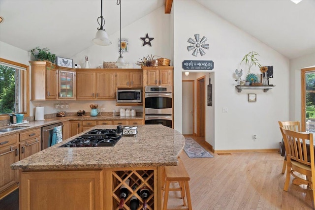 344 Prairie Ave, Winthrop Harbor, IL 60096 - kitchen with appliances with stainless steel finishes, high vaulted ceiling, plenty of natural light, light wood-type flooring, and glass insert cabinets