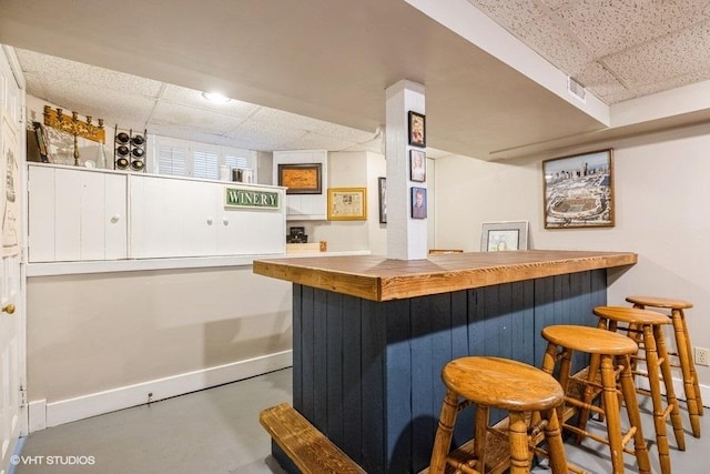 11610 2nd St, Huntley, IL 60142 - indoor dry bar featuring a drop ceiling and concrete floors