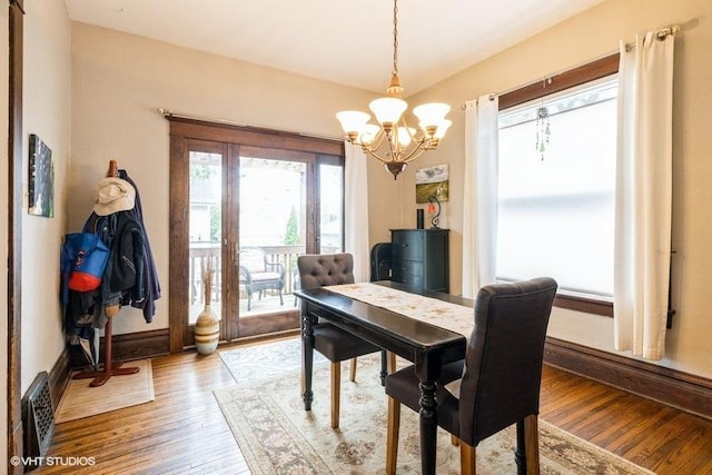 11610 2nd St, Huntley, IL 60142 - dining space with a chandelier and light wood-style floors