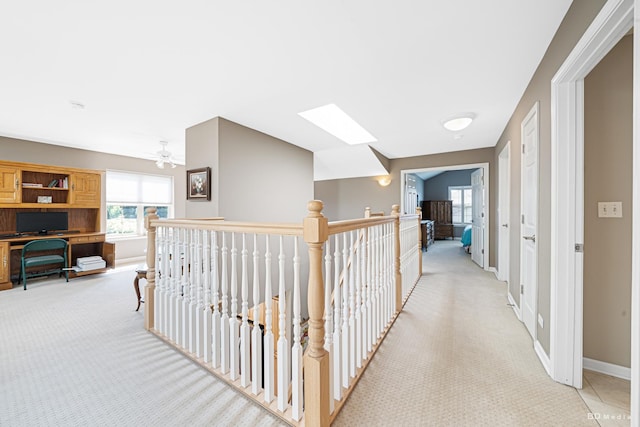 18011 Breckenridge Blvd, Orland Park, IL 60467 - hall with light carpet, an upstairs landing, a skylight, and a desk