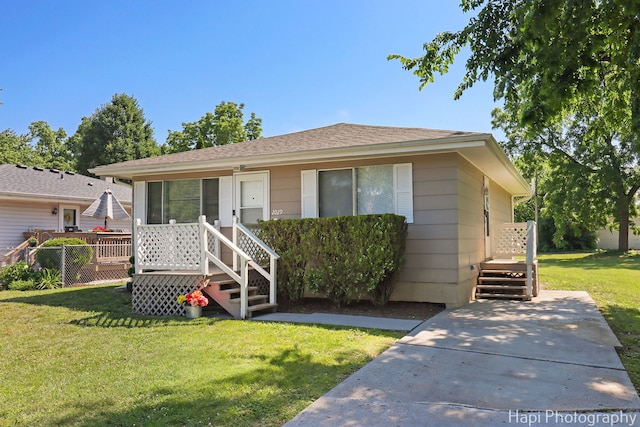 2029 Gabriel Ave, Zion, IL 60099 - bungalow-style home featuring a front yard and roof with shingles