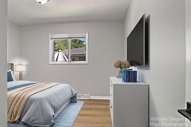 2029 Gabriel Ave, Zion, IL 60099 - bedroom with light wood finished floors and baseboards