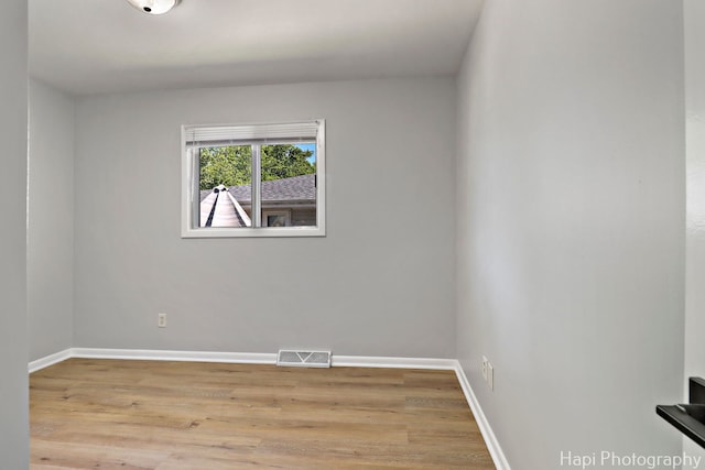 2029 Gabriel Ave, Zion, IL 60099 - spare room featuring wood finished floors and baseboards