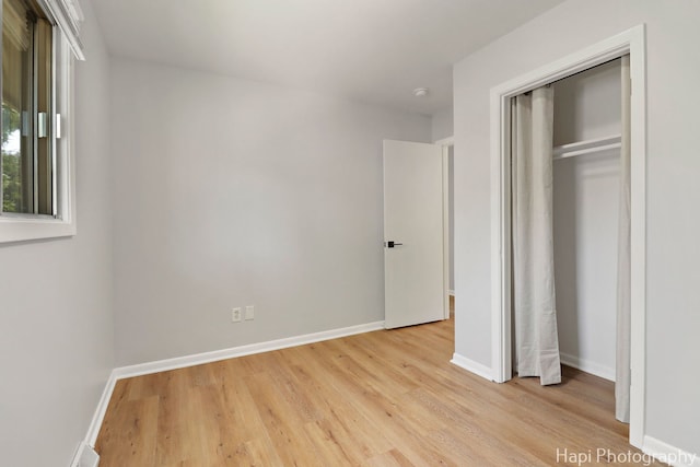2029 Gabriel Ave, Zion, IL 60099 - unfurnished bedroom with light wood finished floors and a closet