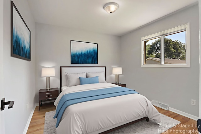 2029 Gabriel Ave, Zion, IL 60099 - bedroom featuring baseboards and wood finished floors