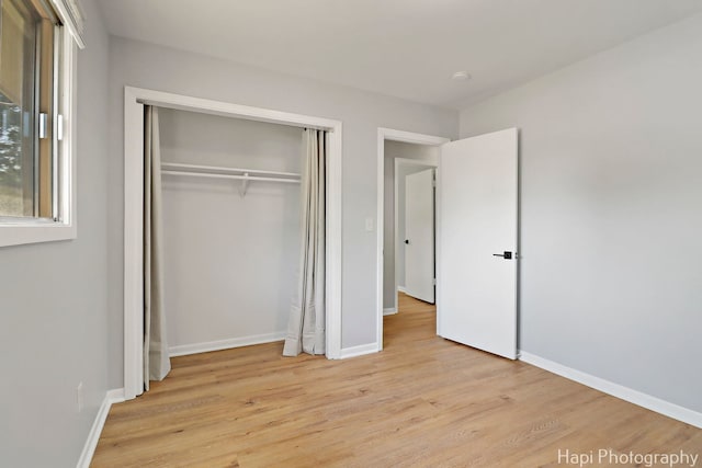 2029 Gabriel Ave, Zion, IL 60099 - unfurnished bedroom featuring light wood finished floors and a closet