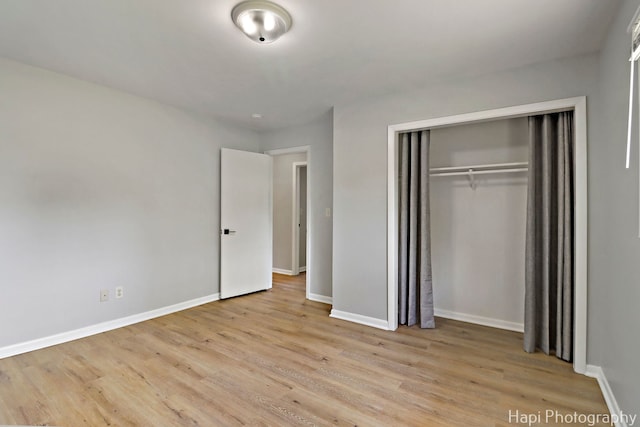 2029 Gabriel Ave, Zion, IL 60099 - unfurnished bedroom featuring wood finished floors and a closet