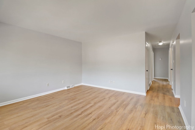 2029 Gabriel Ave, Zion, IL 60099 - spare room featuring light wood-type flooring and baseboards
