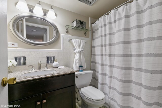 940 Holbrook Rd Unit 34C, Homewood, IL 60430 - full bathroom with tile walls, vanity, wainscoting, and curtained shower
