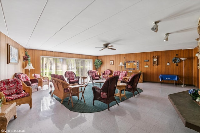 940 Holbrook Rd Unit 34C, Homewood, IL 60430 - living room featuring wooden walls and ceiling fan