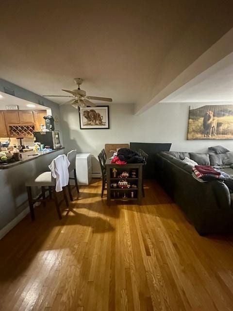 4342 N Kedvale Ave Unit 3C, Chicago, IL 60641 - living room featuring wood finished floors and a ceiling fan