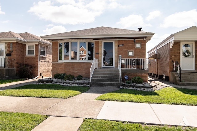 5831 S Meade Ave, Chicago, IL 60638 - bungalow featuring brick siding and a front yard