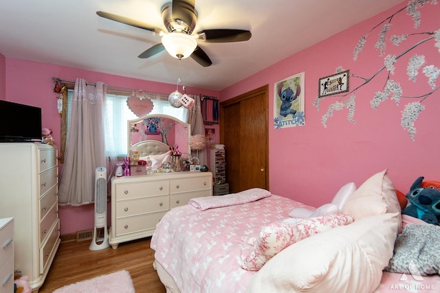 5831 S Meade Ave, Chicago, IL 60638 - bedroom with wood finished floors and ceiling fan