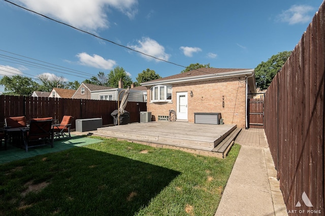 5831 S Meade Ave, Chicago, IL 60638 - rear view of property featuring a fenced backyard, a deck, and brick siding