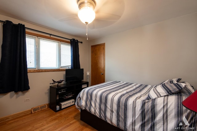 5831 S Meade Ave, Chicago, IL 60638 - bedroom featuring light wood-style floors and baseboards