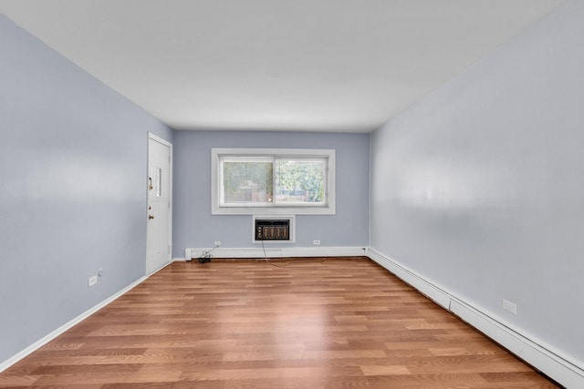 120A Collen Dr Unit 105, Lombard, IL 60148 - spare room featuring a baseboard heating unit and wood finished floors