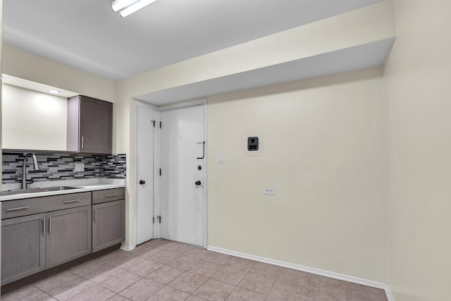 120A Collen Dr Unit 105, Lombard, IL 60148 - kitchen with light countertops, tasteful backsplash, light tile patterned floors, and gray cabinetry