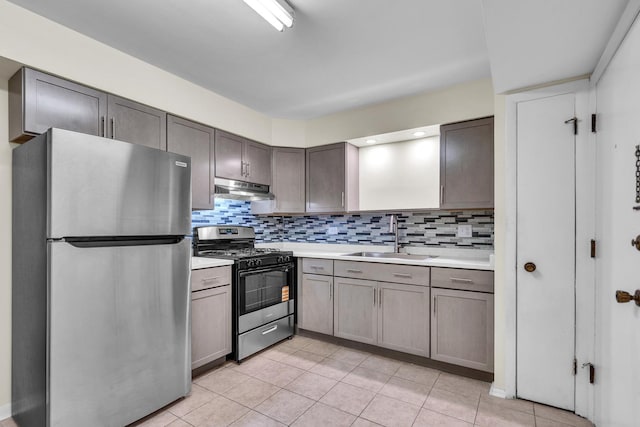 120A Collen Dr Unit 105, Lombard, IL 60148 - kitchen with freestanding refrigerator, gas range oven, under cabinet range hood, light countertops, and light tile patterned flooring