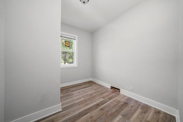 14137 Greenwood Rd, Dolton, IL 60419 - unfurnished room featuring wood finished floors and vaulted ceiling