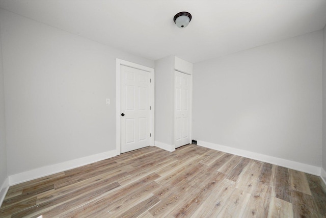 14137 Greenwood Rd, Dolton, IL 60419 - spare room featuring light wood finished floors and baseboards
