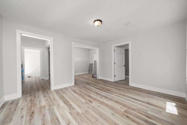 14137 Greenwood Rd, Dolton, IL 60419 - spare room featuring light wood finished floors and baseboards