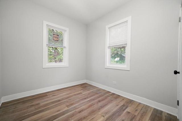 14137 Greenwood Rd, Dolton, IL 60419 - unfurnished room with plenty of natural light and wood finished floors