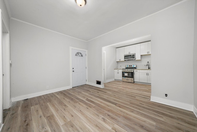 14137 Greenwood Rd, Dolton, IL 60419 - unfurnished living room with ornamental molding and light wood-type flooring