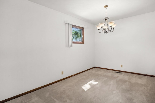 308 Long Ave, North Aurora, IL 60542 - unfurnished room with a chandelier and light colored carpet
